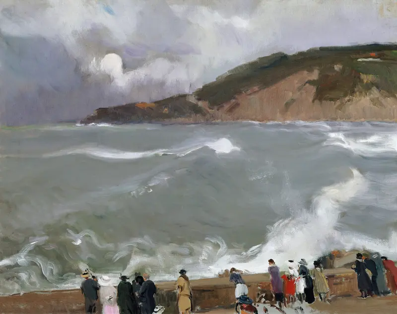 Figures stand along a stone breakwater facing crashing waves and an overcast sky with a rugged headland in the background.