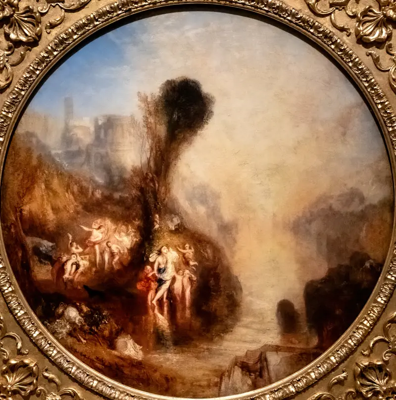 A group of pale-toned figures gathers by a dark hillside under a tall tree, with a distant city and luminous water in the background.