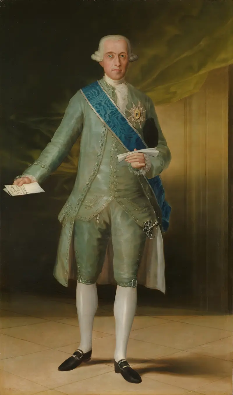 A man in a pale blue-green embroidered suit with a blue sash and star-shaped badge stands holding a letter and document against a dark and architectural background.