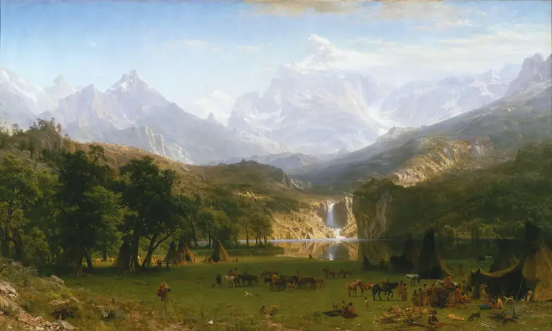 A valley with snow-capped peaks, a reflective lake, waterfall, grassy meadow with tents, horses, and groups of people under a blue sky.