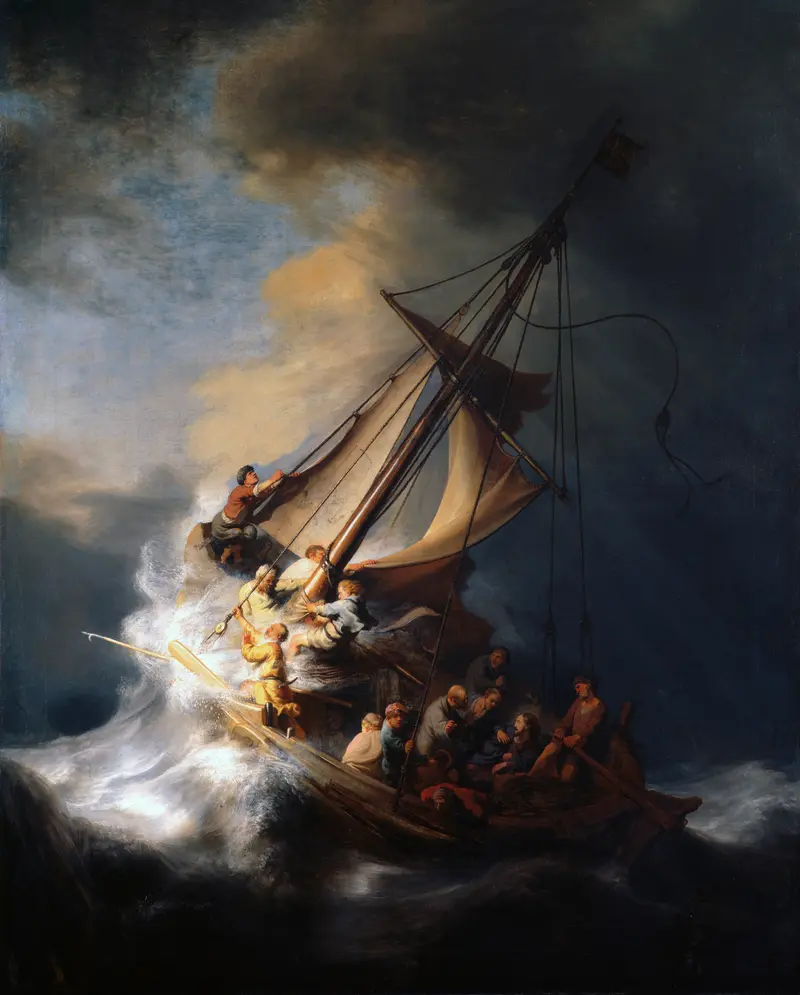 A wooden fishing boat tilts sharply amid towering waves as several men struggle with torn sails and rigging under a stormy sky.